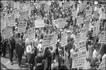 [Demonstrators marching in the street holding signs during the March on Washington, 1963]