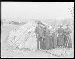 Indians in front of home made by Chippewa Indians 1904