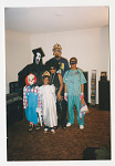 Family dressed up in Halloween Costumes