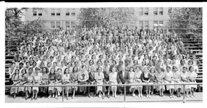 Posed group of young men and women seated on bleachers, ca. 1930-1940 : acetate film photonegative, banquet camera format.