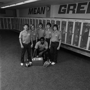 Football staff posing with equipment, 5