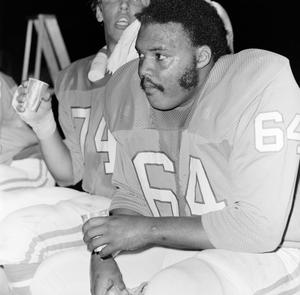 Football player holding a cup