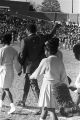 Muhammad Ali on the football field with the cheerleaders from Tuskegee Institute during homecoming activities for Alabama State College on Thanksgiving Day in Montgomery, Alabama.