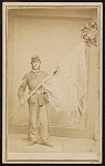 [Second Lieutenant John C. Nutting of Co. I, 4th New Hampshire Infantry Regiment in uniform displaying tattered regimental flag]