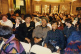 Eugene Redmond with two others in an audience