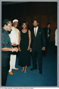 Photograph of Albert Lipscomb posing for a photo with a woman and Joe Tave