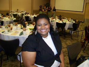 Woman at banquet table in UNT ballroom