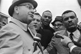 Wilson Baker and C. T. Vivian talking to reporters during the "Berlin Wall" demonstrations in the George Washington Carver Homes neighborhood in Selma, Alabama.