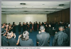 Photograph of the DFW Choir and a crowd of people