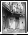 [Courtyard in New Orleans, with African-American inhabitants]