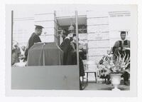 Vivian W. Henderson and an Unidentified Graduate on Stage at Commencement, circa 1965