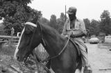 Othar Turner: Gravel Springs and Senatobia, Miss. Fife and drum. Making and playing fife, with horse (OTP 1-76-8 #1136)