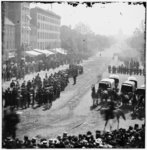 [Washington, D.C. Group of ambulances followed by band and infantry units on Pennsylvania Avenue near the Treasury]