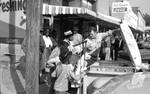 African Americans buying fish on the street: Image 1