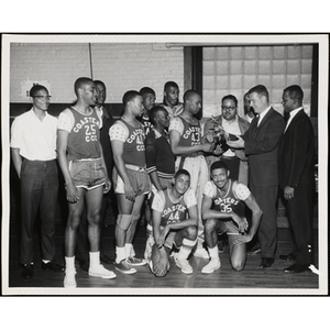 The Coasters team receives a trophy in the 1963 Boys' Clubs of Boston Basketball Tournament