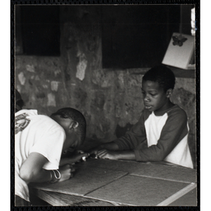 Two boys working on projects for their arts and crafts class at the Boys and Girls Clubs of Boston