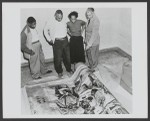 George A. Beavers, Jr., Norman O. Houston, Helen E. Hodge, and Paul R. Williams review one panel of the "Negro in California History" murals