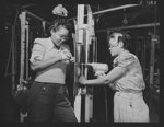 Production. Airplane manufacture, general. Two Negro women employees in North American Aviation's wing sub-assembly department at Inglewood, California, drill and rivet wing sections for fighter and bomber planes. This plant produces the battle-tested B-25 ("Billy Mitchell") bomber, used in General Doolittle's raid on Tokyo, and the P-51 ("Mustang") fighter plane, which was first brought into prominence by the British raid on Dieppe