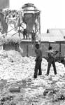 African American boys and white boys outside cotton processing building