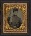 [Unidentified young soldier in Union uniform with stag bone handle knife, revolver, and musket]