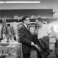 Freedom Rider James Peck with another man at a souvenir counter at the airport in Birmingham, Alabama, waiting to board a flight for New Orleans.