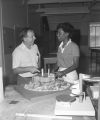 Professor and student discussing a model, probably in a design class at Tuskegee Institute in Tuskegee, Alabama.