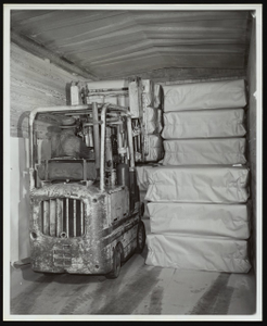 Employee loading packaged chemical cotton at Hercules Hopewell plant