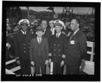 [Untitled negative showing Captain Adrian Richardson (third from left) and part of the crew on the day of the launching of the Liberty ship SS Frederick Douglass, Baltimore, Maryland]