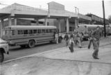 Students and school buses at Booker T. Washington High School