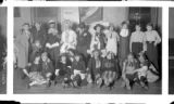 Group portrait of "Hard Times Party" attendees at Schultz Hall