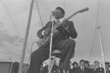 B. B. King: New Haven, Conn. Yale University Graduation. B. B. King at podium, performing at graduation ceremony (BKP 26-77-5/15)