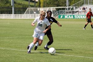 Janaye Woods chasing the soccer ball