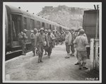 This troop train is being unloaded in Cherbourg, France, bringing the first colored troops to their assigned post of duty