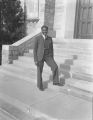 Ralph Metcalfe standing on steps at Xavier University, 1936