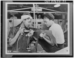 The six plane factories of the Douglas Aircraft Company have been termed an industrial melting pot, since men and women of fifty-eight national origins work side by side in pushing Americas's plane output. S. O. Porter, Douglas director of personnel, recently declared that Negros are doing an outstanding job in all plants. Luedell Mitchell and Lavada Cherry are shown in the El Segundo Plant of the Douglas Aircraft Company