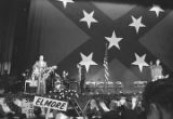 Band performing on a stage at a rally in the Municipal Auditorium in Birmingham, Alabama, during Lurleen Wallace's gubernatorial campaign.