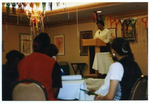 Woman Giving Speech and Audience at Service to Youth Award Program