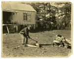 Harry Gray Chopping Wood on Location