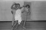 Viola Bradford learning a traditional African dance in a gymnasium, probably in Montgomery, Alabama..