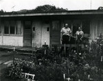 Long-time Marin City resident and community leader Jesse Berry and his wife Flossie, in front of World War II-era housing, circa 1960 [photograph]