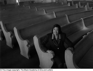 Dorothy N. Cole Davis seated among the pews of a church #2