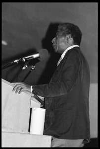 James Baldwin lecturing at UMass Amherst Baldwin standing at a podium with microphones