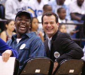 Carlos Linares and Ray Alake Smile During a Ceremony