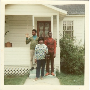 Stephen, David, and Inez Irving Hunter pose on the front steps