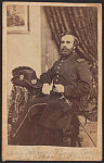 [Assistant Surgeon Henry Boynton of 7th New Hampshire Infantry Regiment in uniform with sword and Hardee hat with medical insignia on table]