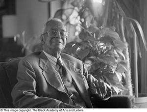 Portrait of Arthur A. Braswell smoking a cigar