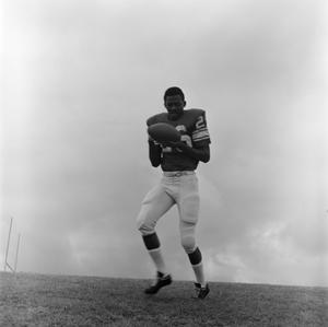 Football player holding the ball, 9