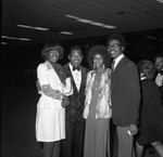 Sugar Ray Robinson posing with others at an event for Mayor Bradley, Los Angeles, 1974