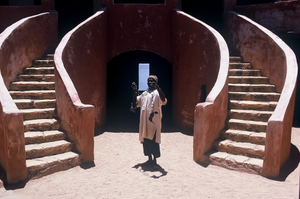 Man holding slave chains, in courtyard of the Slave House, Gorée (island), Senegal