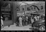 [Untitled photo, possibly related to: Some of the negroes watching itinerant salesman selling goods from his truck in center of town on Saturday afternoon, Belzoni, Mississippi Delta, Mississippi]